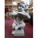 A cherub playing the violin, seated on a socle base, H.50cm