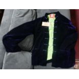 A Chinese, navy blue velvet jacket with lime green silk interior lining. Bearing 2 labels for '