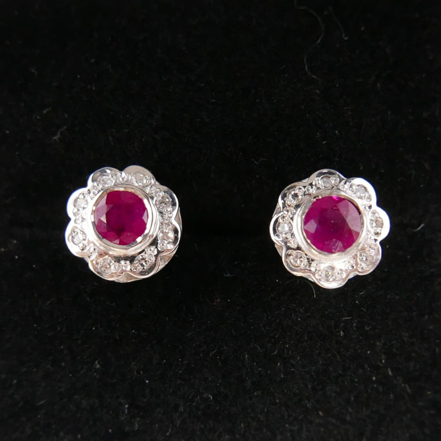 A boxed pair of 9ct yellow and white gold ruby and diamond cluster earrings. Cluster dia: 1cm. - Image 3 of 3