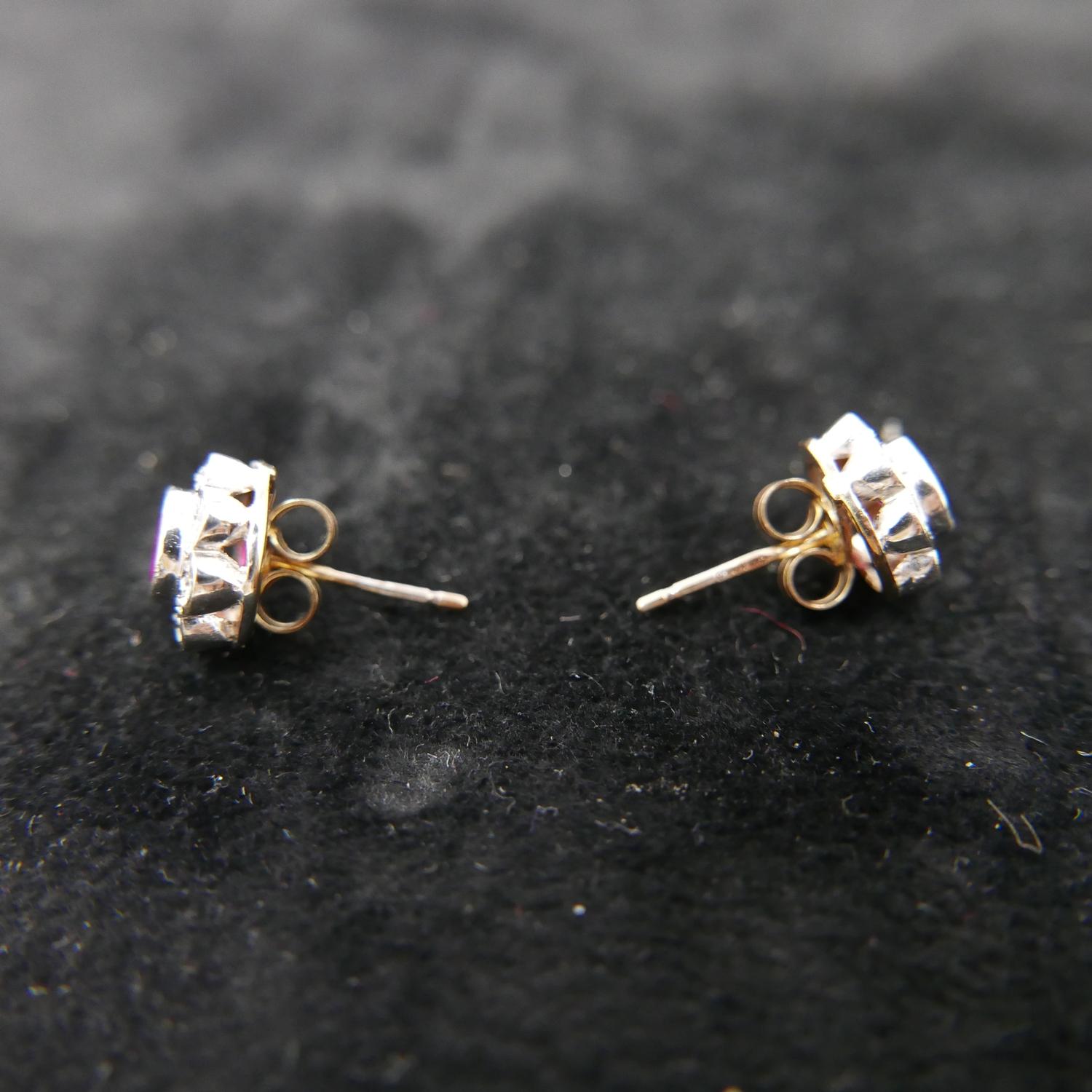 A boxed pair of 9ct yellow and white gold ruby and diamond cluster earrings. Cluster dia: 1cm. - Image 2 of 3