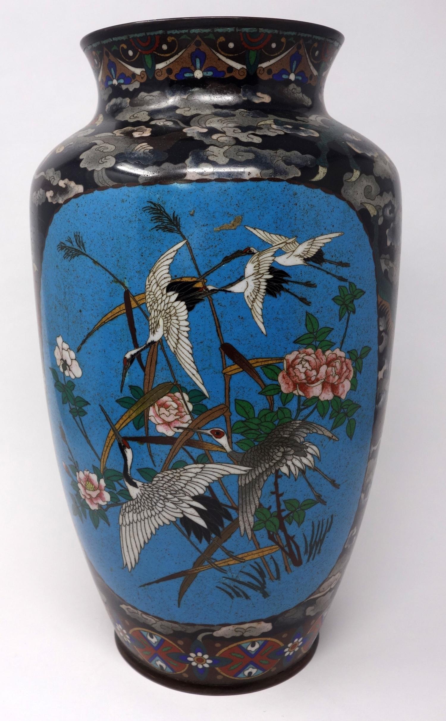 A Chinese cloisonne enamel vase, decorated with vignettes of birds amongst flowers and dragons