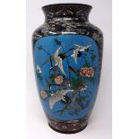 A Chinese cloisonne enamel vase, decorated with vignettes of birds amongst flowers and dragons