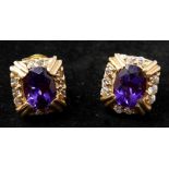 A boxed pair of 14ct yellow gold amethyst and diamond earrings