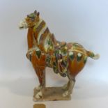 A Chinese Tang style horse, base restored, H.47cm