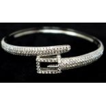 A sterling silver and white crystal studded bracelet of linked fastening design