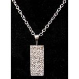 A white gold and diamond pendant necklace