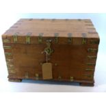 A 20th century Indian teak trunk with brass fittings, H.34 W.58 D.38cm