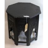 A black painted Moroccan lamp table, H.50 W.50 D.50cm
