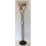 A wrought iron standard lamp with floral frosted glass shade, H.180cm