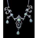 A sterling silver Belle Epoque style necklace set with white crystals and opalites