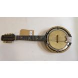 A vintage oak British made banjo with lion makers mark