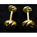 A pair of silver-gilt cufflinks of knotted-ends design
