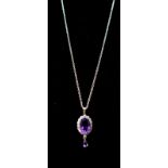 A sterling silver, amethyst and white crystal pendant on a sterling silver chain