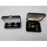 Two leather boxes containing sterling silver cufflinks: 1 rectangular pair (17g) and 4 silver panels