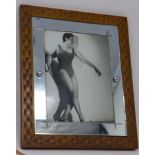 A silver gelatin print of American dancer Cyd Charisse, indistinctly signed lower right, frame and