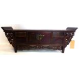 A late 19th century Chinese hardwood table top altar cabinet, H.36 W.101 D.25cm