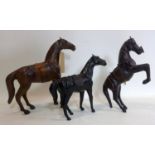 Three vintage leather horses, largest: 40.5 x 40.5cm, smallest: 30 x 33cm