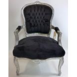 A French silver painted armchair