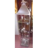 A large chrome and glass floor standing tea light holder of lantern form, H.180 W.41 D.41cm