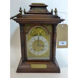 An early 20th century oak mantle clock with brass dial, the movement stamped Lenzkirch, H.35 W.23