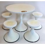 A white fibre glass table and four stools