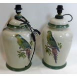 A pair of contemporary crackle glazed lamps decorated with parrots