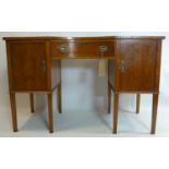 A late 19th century satinwood desk, with marquetry inlay, raised on tapered legs, bearing label