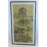 A framed and glazed Chinese watercolour on silk depicting a mountainous vista containing two figures