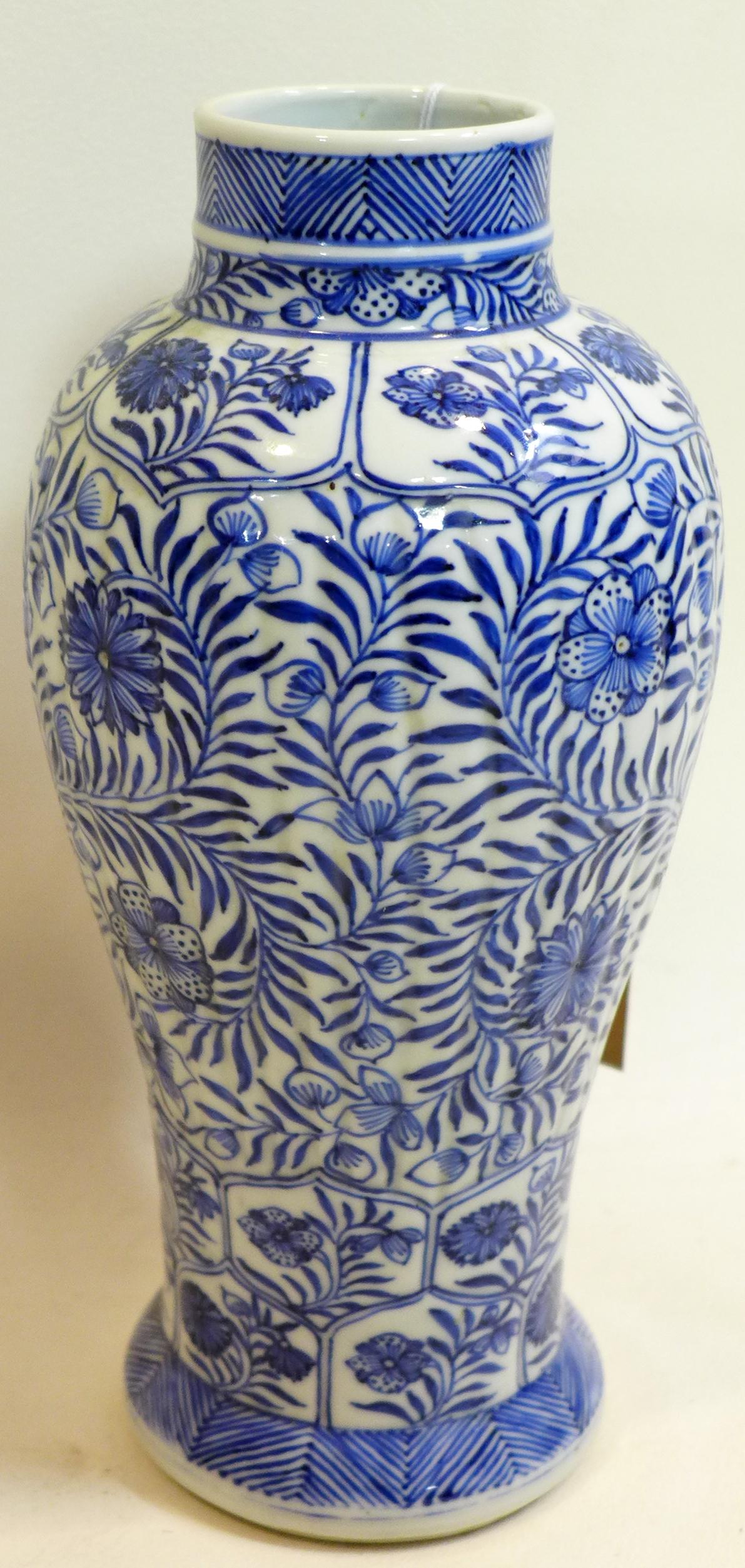 A Chinese Kang Xi period blue and white porcelain vase with floral decoration, H.25cm