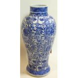 A Chinese Kang Xi period blue and white porcelain vase with floral decoration, H.25cm