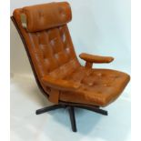 A mid 20th century tan leather swivel chair by Gote Nassjo