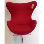 An Arne Jacobsen style egg chair, stamped Fritz Hansen to base