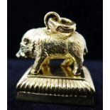 A gold plated seal in the form of a boar