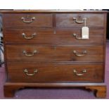 A Georgian mahogany chest, two short over three long drawers, raised on bracket feet, H.92 W.94 D.