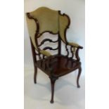 A Jas Shoolbred Art Nouveau mahogany wing back armchair, with makers label