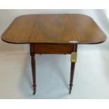 An early 19th century mahogany pembroke table, with rosewood cross banding, two end drawers,