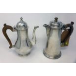 A Garrard & Co. Ltd hot water pot and tea pot, with wooden handles, by Sebastian Harry Garrard,