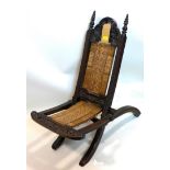 A 19th century Anglo-Indian carved oak folding chair