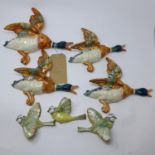 Four vintage ceramic hand-painted ducks Largest: 25 x 25cm with three hand-painted Beswick