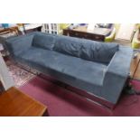 An Andrew Martin gunmetal grey velvet sofa, raised on chrome base, H.69 W.253 D.98cm