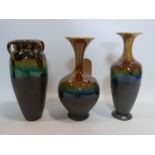 Three Persian Isfahan drip glazed vases of varying size and form, H.32cm (tallest)