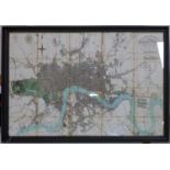 A large printed map of London, framed, 82 x 124cm