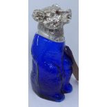 A blue glass and silver plated decanter in the form of a seated bear with faceted purple glass