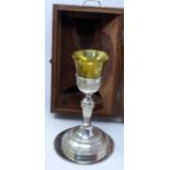 An early 20th century silver plated and gilt metal communion goblet and tray in fitted mahogany box.