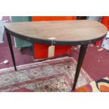 A Industrial demi lune table, on square tapered legs, H.76 W.140 D.71cm