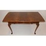 A walnut dining table raised on cabriole legs, H.75 W.152 D.81cm