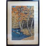 An early 20th century Japanese wood block print, tree by a river, signed, 36 x 23cm