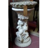 A cherub and grapevine stone bird bath, H.72cm