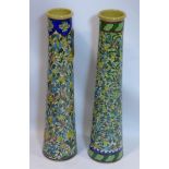 Two Persian Isfahan bamboo vases of tapered form, decorated with flowers, H.70cm