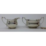 A silver milk jug and sugar bowl, by Adie brothers, Birmingham 1937, with angular handles and